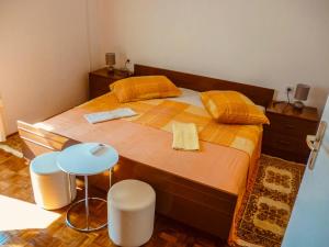 Postel nebo postele na pokoji v ubytování Apartmani Babaja