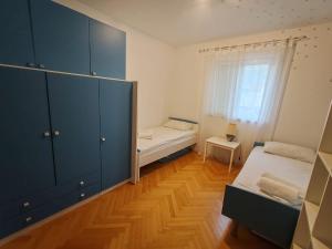 Postel nebo postele na pokoji v ubytování Apartment EMMI