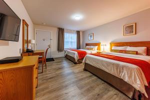 Postel nebo postele na pokoji v ubytování Hotel-Motel Castel de la Mer