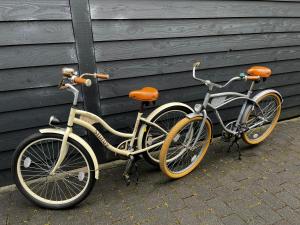 two bikes parked next to each other next to a building at Noflik Heerenveen in Heerenveen