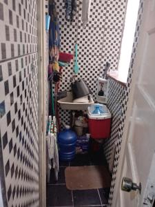 a small bathroom with a sink and a toilet at APMartinsjreige in São Vicente