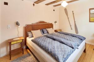 En eller flere senge i et værelse på Winzerhaus 1658 - Ferienwohnung und Apartments