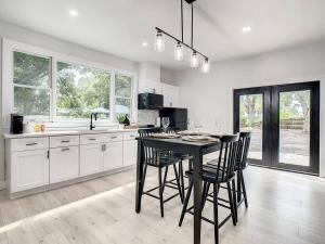a kitchen with a table and chairs in it at Cozy Getaway Home - near Siesta Key Beach in Sarasota