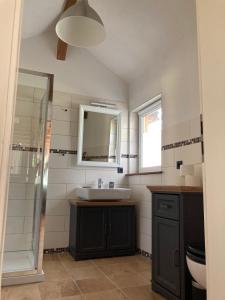 a bathroom with a sink and a shower at Zum Ilmwinkel in Bad Sulza