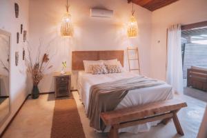 Ένα ή περισσότερα κρεβάτια σε δωμάτιο στο Abacate Casa do Mar