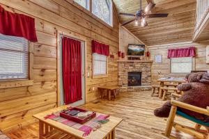a teddy bear sitting in a chair in a room with a fireplace at Always Misbehavin #1412 in Gatlinburg