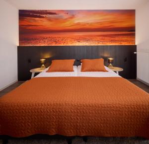 Postel nebo postele na pokoji v ubytování Hotel 't Gemeentehuis