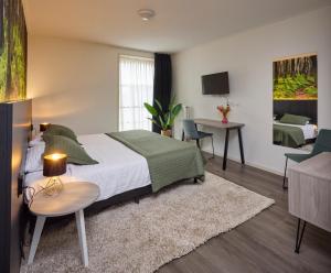 Postel nebo postele na pokoji v ubytování Hotel 't Gemeentehuis