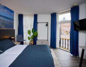 Postel nebo postele na pokoji v ubytování Hotel 't Gemeentehuis