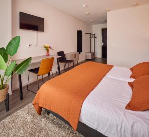 Postel nebo postele na pokoji v ubytování Hotel 't Gemeentehuis