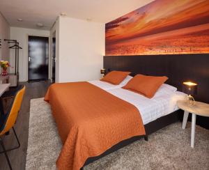 Postel nebo postele na pokoji v ubytování Hotel 't Gemeentehuis