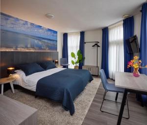Postel nebo postele na pokoji v ubytování Hotel 't Gemeentehuis