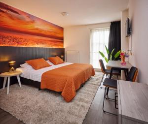 Postel nebo postele na pokoji v ubytování Hotel 't Gemeentehuis
