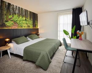 Postel nebo postele na pokoji v ubytování Hotel 't Gemeentehuis