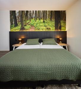 Postel nebo postele na pokoji v ubytování Hotel 't Gemeentehuis