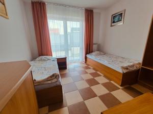 Postel nebo postele na pokoji v ubytování Willa Arka we Władysławowie-Chłapowie