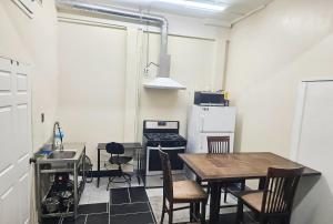 a kitchen with a table and chairs in a room at Los Angeles Zen Home in Los Angeles