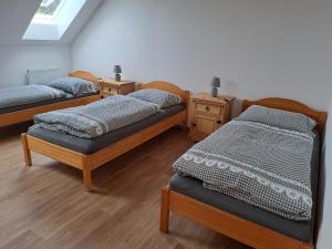 Postel nebo postele na pokoji v ubytování Pension Na Statku- Kočičí apartmán