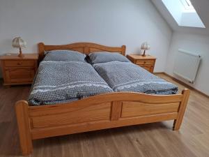 Postel nebo postele na pokoji v ubytování Pension Na Statku- Kočičí apartmán