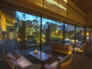 a living room with furniture and a large window at Hotel Yagi - Vacation STAY 21622v in Awara