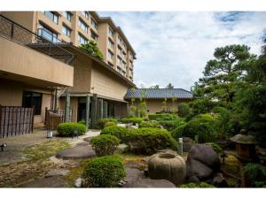 a garden in front of a building at Hotel Yagi - Vacation STAY 21622v in Awara
