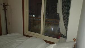 A bed or beds in a room at Nile House