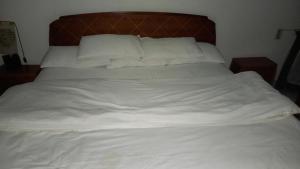 A bed or beds in a room at Nile House