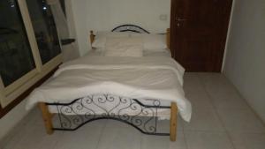 A bed or beds in a room at Nile House