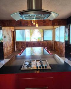 a kitchen with a stove and a counter top at Casa en la playa in Ciudad del Carmen