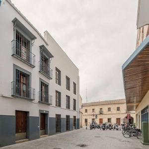 a group of motorcycles parked in a building at ISG apartments Puerta Jerez Sevilla 02 in Seville