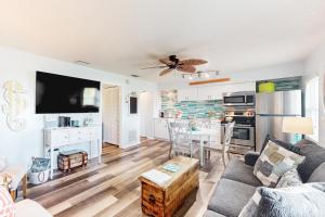 a living room with a couch and a table at Nautical Nook at Bayview Inn in Bradenton Beach