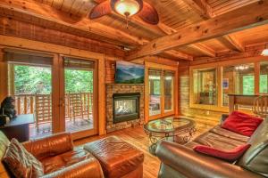 a living room with a couch and a fireplace at Gone Swimmin' #260 in Pigeon Forge
