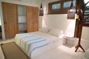 Кровать или кровати в номере Hotel Playa Scondida Barú