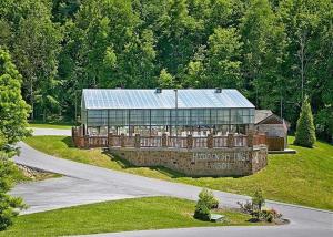 an aerial view of a large house with a building at Kissing Retreat #269 in Sevierville