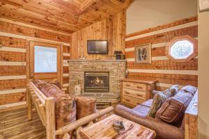 a log cabin living room with a fireplace at Leather And Lace #1615 in Gatlinburg
