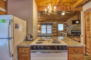 a kitchen with a stove and a refrigerator at Linger Longer #1607 in Gatlinburg +20 photos