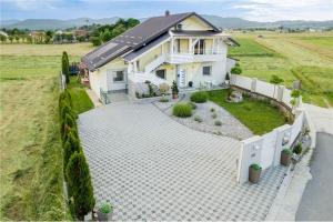 an aerial view of a house with a driveway at Ferienwohnung Luna mit Pool in Brinje