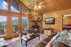 a living room with a couch and a fireplace at Majestic View #412 in Sevierville