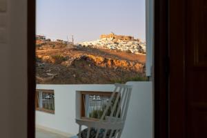 a view of a hill from a window of a house at Allegro seasight appartment in Livadi Astypalaias