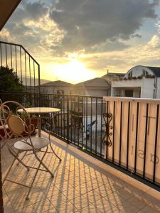 a balcony with a table and chairs on a balcony at TreMonti in Guardiagrele +31 photos