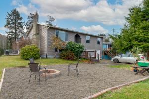 two chairs and a fire pit in front of a house at Rockaway Beach Vacation Rental Walk to Ocean in Rockaway Beach