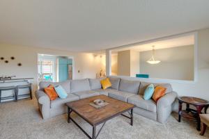 a living room with a couch and a table at Rockaway Beach Vacation Rental Walk to Ocean in Rockaway Beach