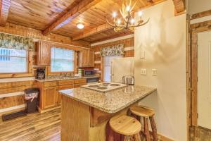 a kitchen with wooden cabinets and a counter top at Moonshine Madness #1611 in Gatlinburg