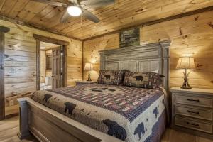 a bedroom with a bed in a log cabin at Pooling Around #200 in Gatlinburg +46 photos