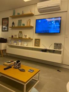 TV a/nebo společenská místnost v ubytování Casa condomínio Las Olas Imbé