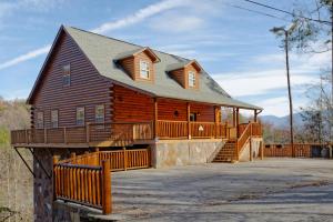 a large wooden house with a large deck at Redneck Ritz #724 in Gatlinburg