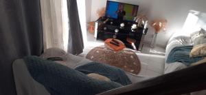 a person sitting on a couch in a living room at Sunbeachparadise in Port-Louis