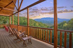 a porch with chairs and a view of the mountains at Splash Mansion #500 in Gatlinburg