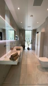 a bathroom with a sink and a toilet at Villa EA Bergen in Bergen +61 photos
