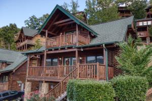 a large wooden house with a large deck at Starry Nights #222 in Pigeon Forge
